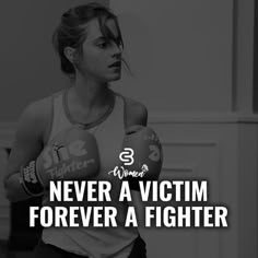 a woman wearing boxing gloves with the words never a victim forever a fighter