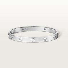 Cartier - LOVE bracelet, 4 diamonds - Bracelet White gold/Gold - LOVE bracelet, 18K white gold (750/1000), set with 4 brilliant-cut diamonds totaling 0.42 carats. Comes with a screwdriver. Width: 6.1 mm. Created in New York in 1969, the LOVE bracelet is an icon of jewelry design: a close fitting, oval bracelet composed of two rigid arcs which is worn on the wrist and removed using a specific screwdriver. The closure is designed with two functional screws placed on either side of the bracelet: yo Bracelet White Gold, Trinity Ring, Punk Vintage, Bracelet Love, Love Bracelet, Bracelet Collection, Cartier Love Bracelet, Love Necklace, Love Bracelets