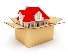 a cardboard box with a house in it and the words we make mortgages easy really easy