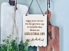 a wooden sign that says, may you never be to grown up to search the skies on christmas eve