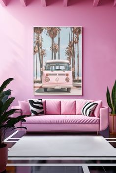 a living room with pink couches and palm trees on the wall above it is a vw bus