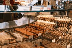 a display case filled with lots of different types of chocolates