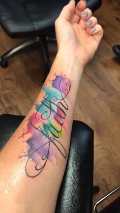 a woman's arm with a tattoo that reads, believe on it and the word love