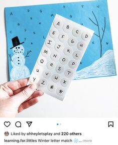 someone is making a snowman letter match