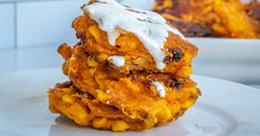 a stack of food sitting on top of a white plate