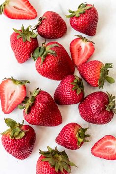 strawberries arranged in the shape of a circle on a marble surface