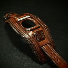 "This vintage brown applewatch cuff watchband uses the highest quality natural vegetable-tanned leather .  A soft calfskin lining hugs your wrist and a high quality buckle closes it up! It features hand tooling, a braided lace edge and laced chevrons. There's nothing like this watchband! I'll need your wrist size, Apple watch size and Apple watch finish (grey, stainless. polished) I Can size it for men or women  Adapters included! Can be made many finishes and colors. Just ask! - 2.5\" wide - sa Apple Watch Bands Mens, Leather Watch Cuff, Handmade Watch Strap, Nato Strap Watches, Apple Watch Sizes, Handmade Watch, Handmade Leather Bracelets, Apple Watch Ultra, Cuff Watch