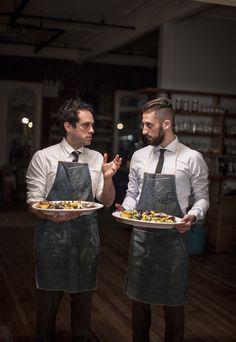 like their aprons! | novh: The Sussman brothers Restaurant Uniform, Cafe Uniform, Waiter Uniform, Restaurant Uniforms, Hotel Uniform, Staff Uniforms, Kitchen Clothes, Chef Uniform