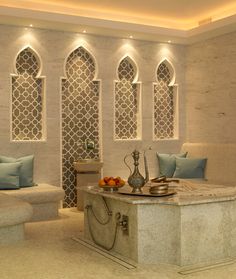 a living room filled with furniture and walls covered in white stone tiles on the ceiling