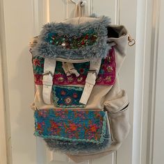 Handmade Unique Backpack On The Smaller Side- Was Not Big Enough For Me And My Toddlers Needs Canvas Base Backpack With Unique Details And Designs Very Boho Style Has Lots Of Pockets Would Be Cute For A Festival Or Summer Events It’s Like New- Never Used By Me Coming From A Low Scent No Smoking Home Ask Any Questions Bohemian Beige Backpack, Beige Bohemian Style Backpack, Bohemian Beige Rectangular Backpack, Handmade Backpack, Unique Backpacks, Handmade Backpacks, Lots Of Pockets, Summer Events, Blue Cream