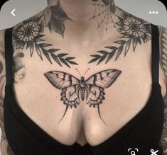 a woman's chest with a butterfly tattoo on it