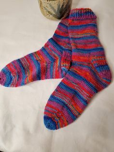 Keep your feet comfortable all year long in hand knit wool socks. Great to wear in boots or sneakers.  Keep you feet warm in winter and cool in summer.  Wool fibers keep air circulating and wick away sweat and moisture. Wool is naturally odor resistant and has antimicrobial properties. Variations exist in manufactured product. Child sized medium 3-7 shoe 75% superwash wool  25% nylon  Turn inside out and hand wash or gentle machine wash in cool water and lay flat to dry Comfortable Knitted Socks, Hand Knitted Comfortable Yarn Socks, Casual Comfortable Hand Knitted Socks, Casual Hand Knitted Socks, Casual Warm Multicolor Socks, Hand Knitted Yarn Socks Casual Style, Comfortable Blue Knitted Socks, Comfortable Warm Multicolor Socks, Handmade Multicolor Casual Socks