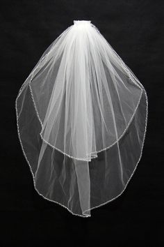 a white veil on top of a black background