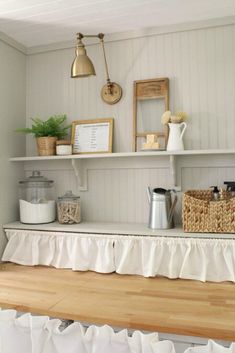 a shelf with some items on it and a basket in the corner next to it