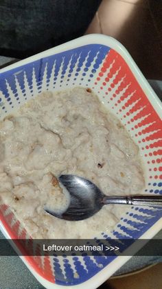 a bowl of oatmeal with a spoon in it