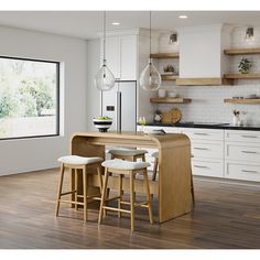 a kitchen with wooden floors and white cabinets, two stools at the center of the island