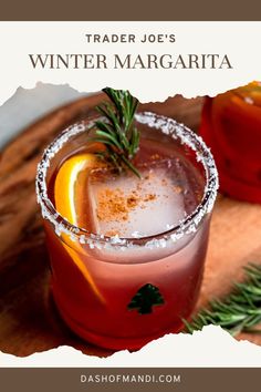 two cocktails on a cutting board with rosemary garnish