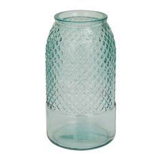 a clear glass vase sitting on top of a white table