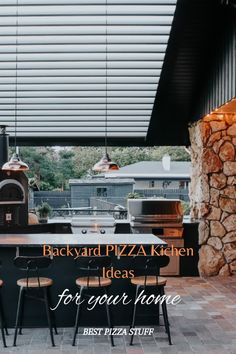 a kitchen with an outdoor pizza oven and bar stools in front of the counter