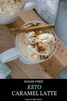 two mugs of keto caramel latte on a cutting board with cinnamon sticks