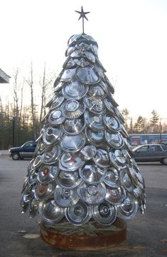 a metal christmas tree made out of cans