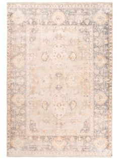 an antique rug with various colors and patterns on the carpet, including beiges, blues