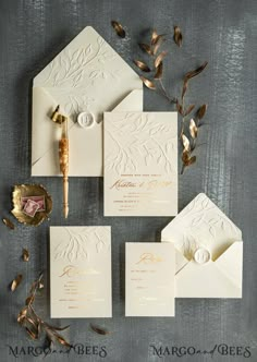 the wedding stationery is laid out and ready to be put into their guests'envelopes