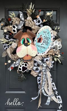 a dog's front door is decorated with black, white and silver ribbons that say hello