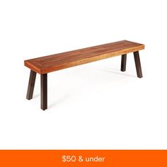 a wooden bench sitting on top of a white floor next to an orange sign that says $ 50 & under