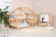 a baby's room with pink walls and white floors