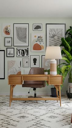 a desk with a lamp and pictures on the wall behind it in a living room