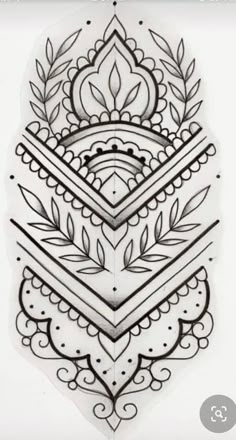 an intricately designed tattoo design on the back of a white sheet with black ink