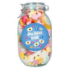 a jar filled with lots of different colored candies