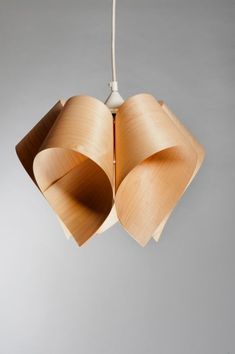 a light fixture with the words free shipping on it and an image of three wooden lamps