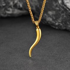 Meaningful Cornicello Amulet Italian Horn Necklace: Every Italian can proudly wear these Italian Horn necklace charms, believed to protect the wearer from jealousy, envy, and the Evil Eye. Minimalist Italian Horn necklace is glittering with gold shine capturing attention from all around. Stunning & Attractive amulet accessories.
Minimalist Italian Horn Necklace: Dangling below the wheat chain is the Italian horn pendant that is glittering with gold shine capturing attention from all around. Stun Eye Minimalist, Italian Horn Necklace, Accessories Minimalist, Horn Pendant Necklace, Italian Horn, Necklace Charms, Horn Necklace, Horn Pendant, Mens Pendant