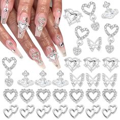 PRICES MAY VARY. Value Pack:You will get 30pcs exquisite nail art charms in different shape design.Enough quantity can satisfy your different decorative needs,making your nails art stylish and more charming. Excellent Design:These silver nail charms have various style,including saturn planet,butterfly,dangle heart,hollow heart and more.Alloy metal base inlaided with clear rhinestone,looking shiny and bling.With these charms,you will have brighter and more unique nails art. Wide Application:Diffe Charms For Nails, Planet Nails, Silver Nail Art, Nail Gems, Saturn Planet, Country Nails, Nail Art Charms, Butterfly Nail Art, Heart Nail