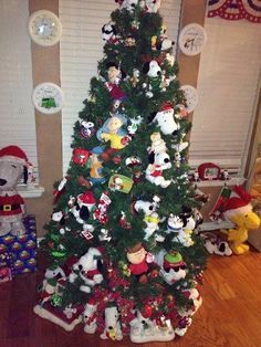 a christmas tree with many stuffed animals on it