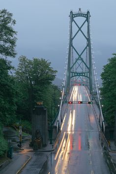 a long bridge with cars driving across it