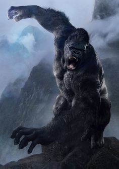 a large gorilla standing on top of a mountain with its mouth open and it's claws out