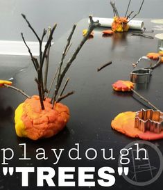 there is a playdough with trees on the table