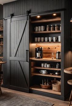 an open pantry with wooden shelves and sliding doors