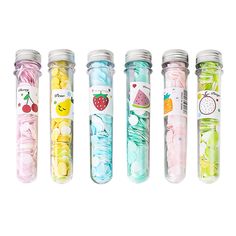 four glass bottles with different designs on them