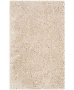 an area rug with white shag on the top and bottom, it is very soft