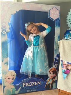 the frozen princess doll is in its box and ready to be opened for her party