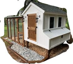 a chicken coop with the door open and windows on it's side is shown