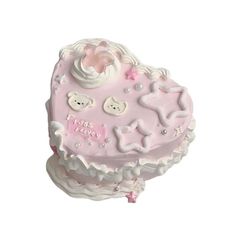 a pink heart shaped cake with white frosting and teddy bears on it's side