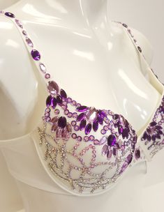 Beautifully hand decorated beaded push up bra in ivory combination decorated with purple gems in assorted colors and sequins. *Individually hand decorated. *Perfect for any occasion. *Lightweight, very comfortable to wear. *Floral design decoration. *Available in multiple US sizes. *2 hooks-eye position at the back for better fitting. *Adjustable shoulder straps. *Free USPS First Class shipping within the US. Shipping upgrade available. *Items located in the US meaning fast order processing/hand Belly Dance Bra Design, Bra Decorating Ideas, Burlesque Bra, Decorated Bras, Bra Ideas, Bra Art, Belly Dance Bra, Diy Gem, Diy Bra