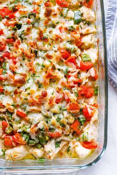 a casserole dish filled with chicken and vegetables