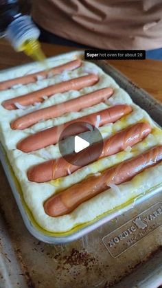 the hot dogs are being cooked in the oven