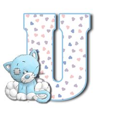 the letter u is decorated with hearts and a blue teddy bear sitting in front of it